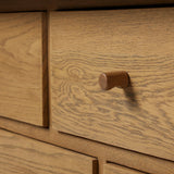 Drawing inspiration from a vintage general store counter, a storage-driven dresser reflects traditional and functional design. Thick oak legs with softened corners provide sturdy support, while oak knobs add a classic touch. An inset tray top and a versatile drawer configuration offer ample storage Amethyst Home provides interior design, new home construction design consulting, vintage area rugs, and lighting in the Tampa metro area.