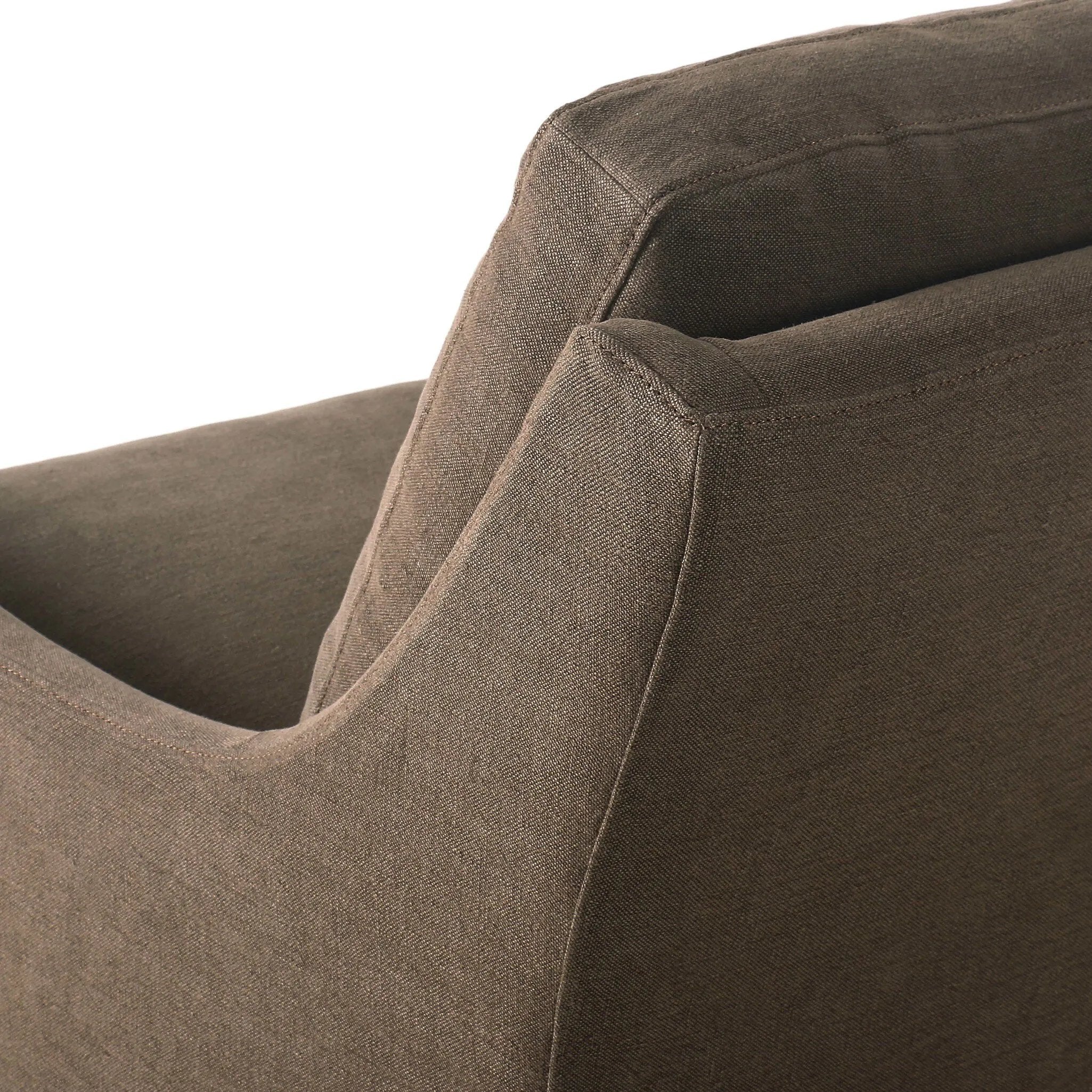 This relaxing glider chair is defined by slightly sloping, flared arms and a floor-length slipcover that's finished in a soft, tight weave for a traditional style Amethyst Home provides interior design, new home construction design consulting, vintage area rugs, and lighting in the Laguna Beach metro area.