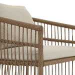 Cottage-inspired, faux hyacinth mimics its natural counterpart, with joint wrapping and texture for depth and character defining this outdoor dining chair. Varied proportion for dimension. Upholstered in a UV-resistant, water-repellent, quick-drying fabric. Cover or store indoors during inclement weather and when not in use Amethyst Home provides interior design, new home construction design consulting, vintage area rugs, and lighting in the Park City metro area.