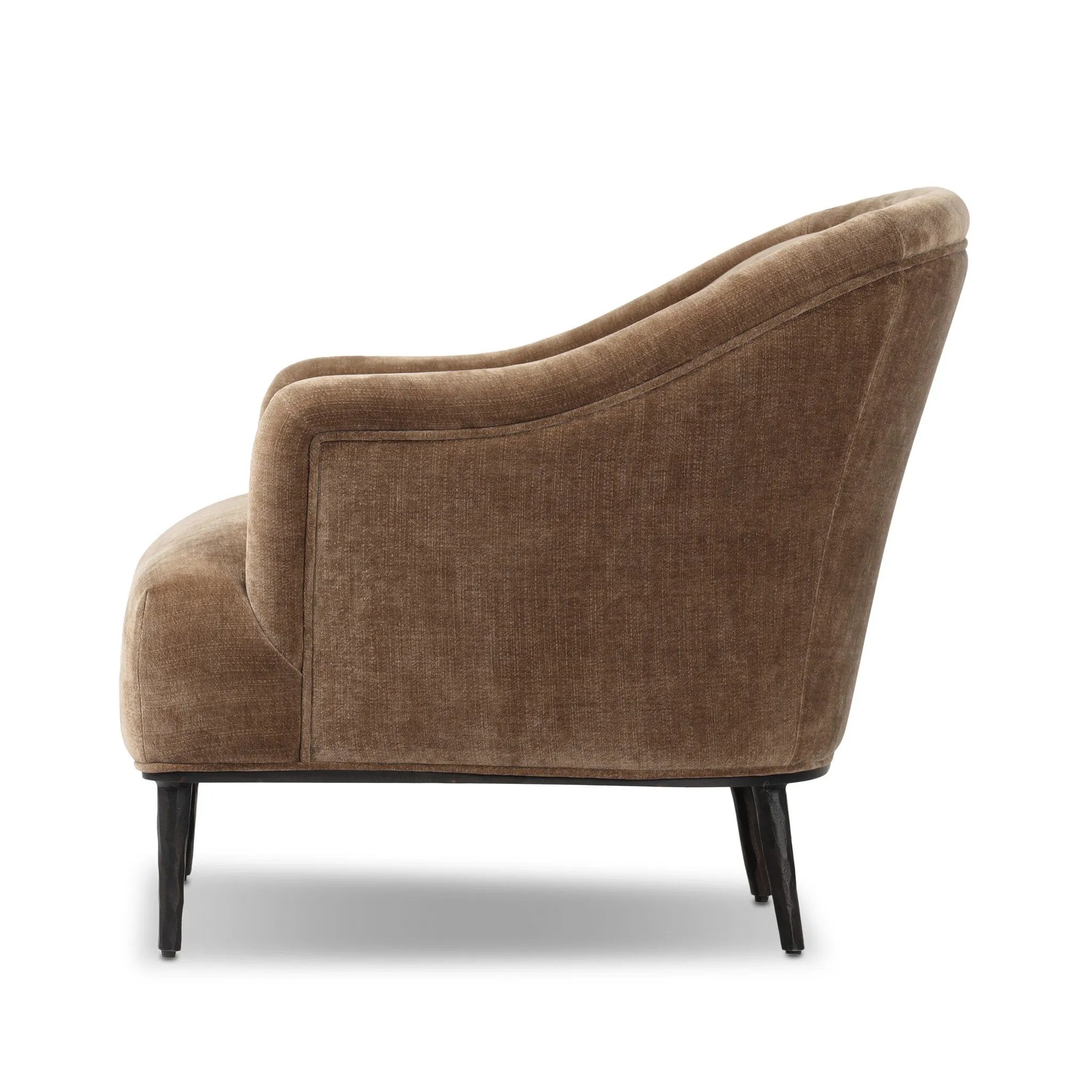 With elements of past eras at play, this updated Deco chair features a rounded back, sloped arms and a dramatic channel. The