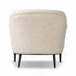 With elements of past eras at play, this updated Deco chair features a rounded back, sloped arms and a dramatic channel. The iron base and tapered legs support the cushiony seat — built with spring suspensions for long-lasting comfort. Amethyst Home provides interior design, new home construction design consulting, vintage area rugs, and lighting in the Houston metro area.