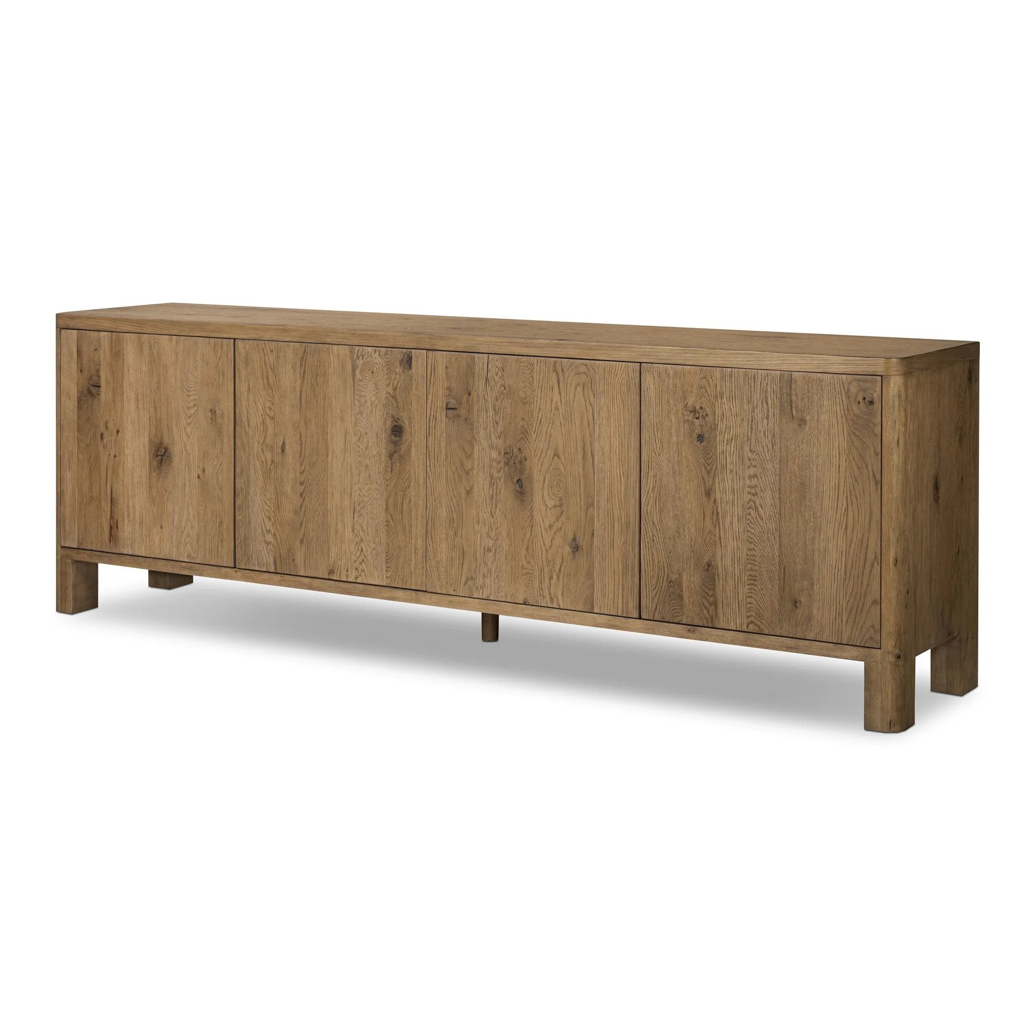 Featuring Noeline Resawn Worn Oak Sideboard by Four Hands at Amethyst Home. Made from resawn oak with a worn, natural finish, a long, streamlined sideboard offers ample storage space behind four push-latch doors. Subtly rounded corners add softness to otherwise clean lines, while knots and graining offer a naturally rich look. Dual rear cutouts for seamless co. Amethyst Home provides interior design, new home construction design consulting, vintage area rugs, and lighting in the Boston metro area.