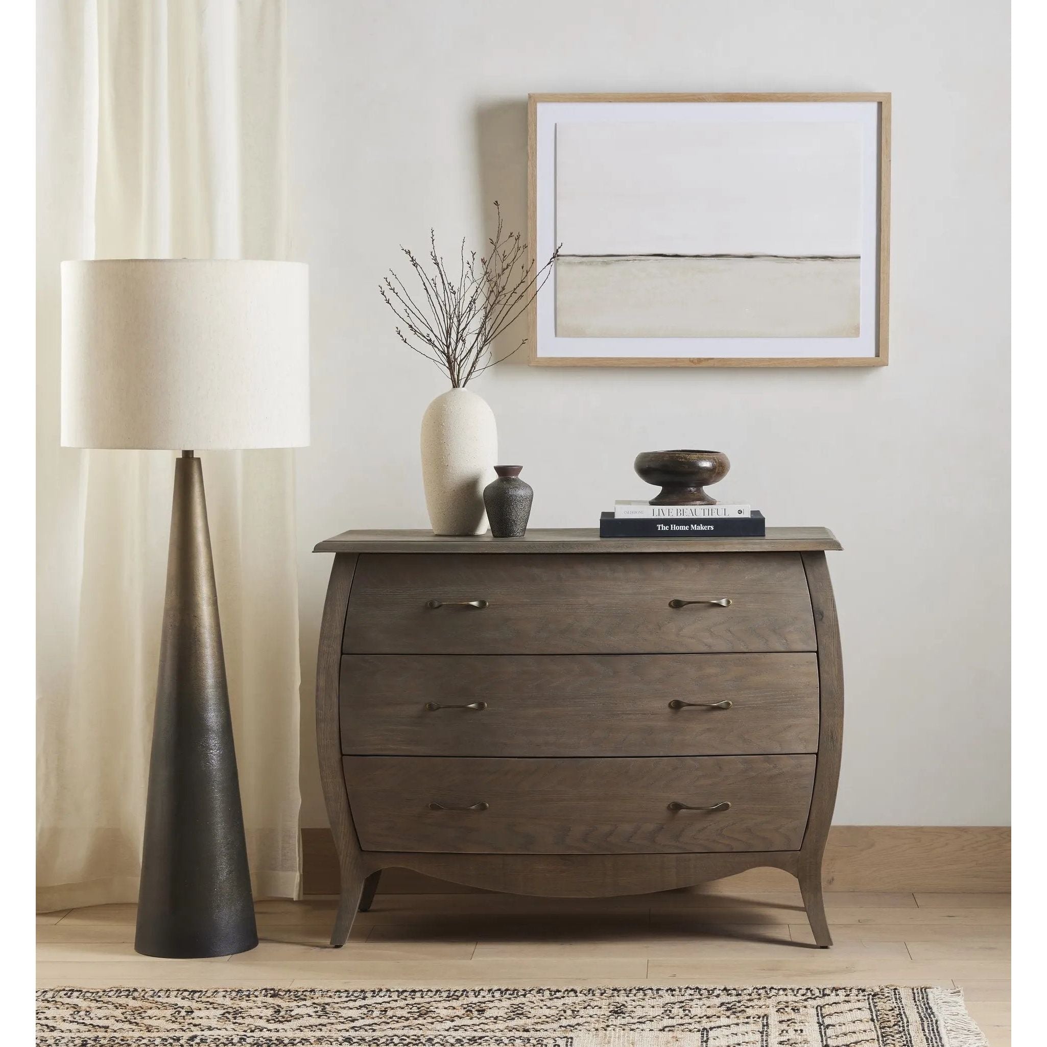 A striking silhouette. An antique brass finish highlights iron's gradual blending of hues for a distinctive ombre effect on this tapered metal base. Topped with a 100% cotton shade Amethyst Home provides interior design, new home construction design consulting, vintage area rugs, and lighting in the Calabasas metro area.