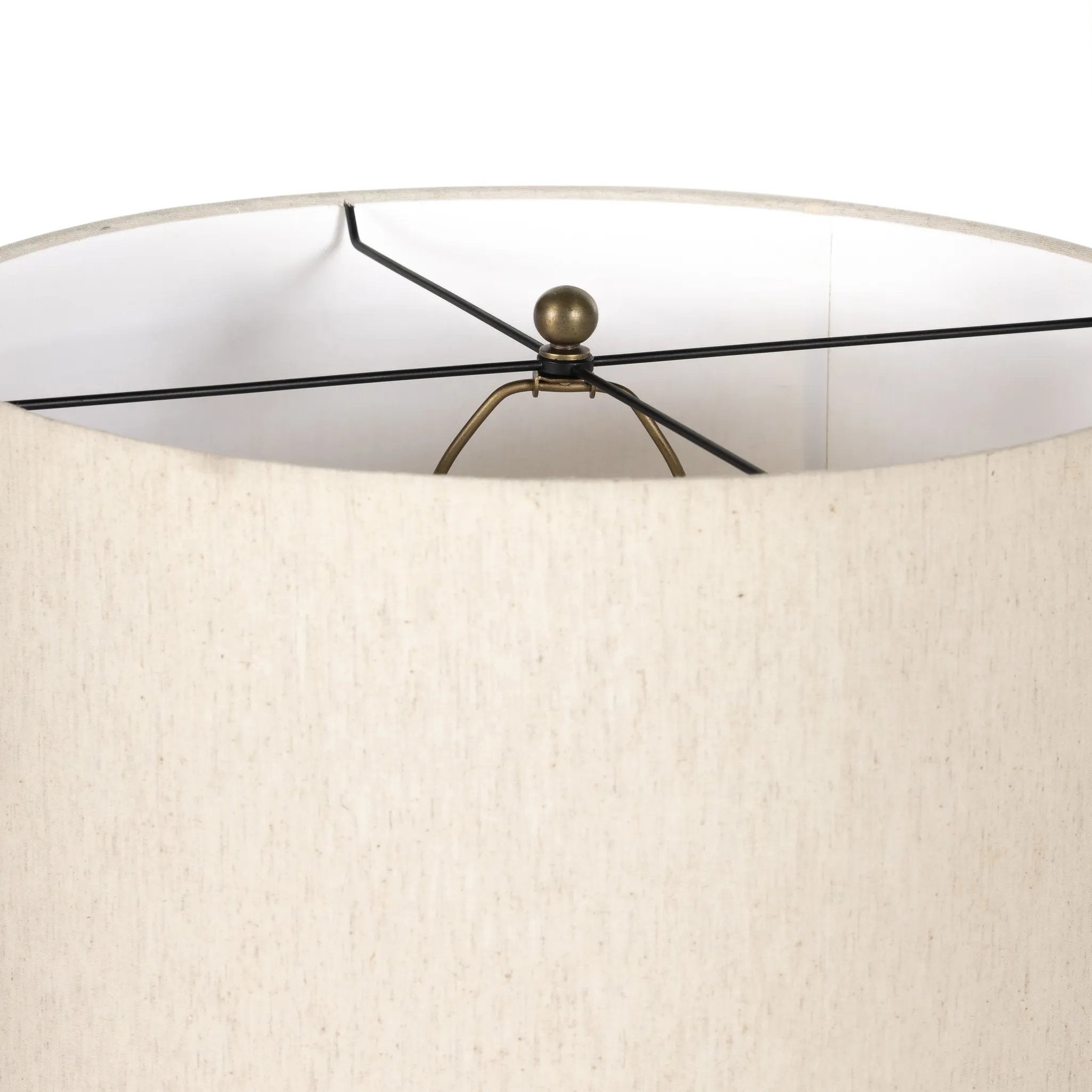 A striking silhouette. An antique brass finish highlights iron's gradual blending of hues for a distinctive ombre effect on this tapered metal base. Topped with a 100% cotton shade Amethyst Home provides interior design, new home construction design consulting, vintage area rugs, and lighting in the Houston metro area.