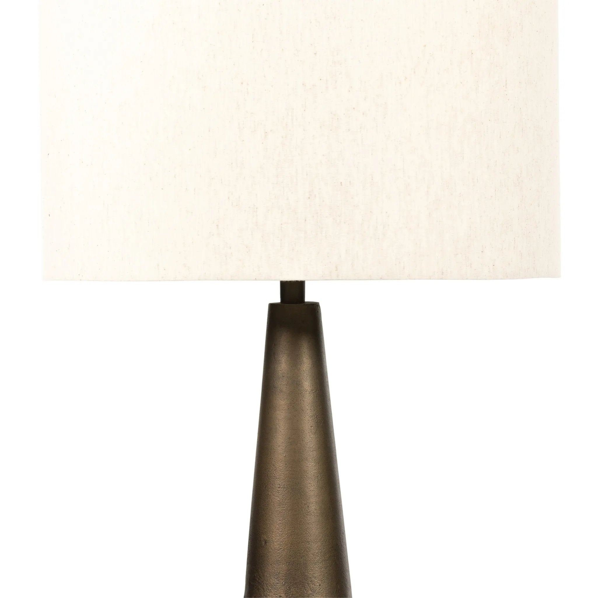 A striking silhouette. An antique brass finish highlights iron's gradual blending of hues for a distinctive ombre effect on this tapered metal base. Topped with a 100% cotton shade Amethyst Home provides interior design, new home construction design consulting, vintage area rugs, and lighting in the Newport Beach metro area.