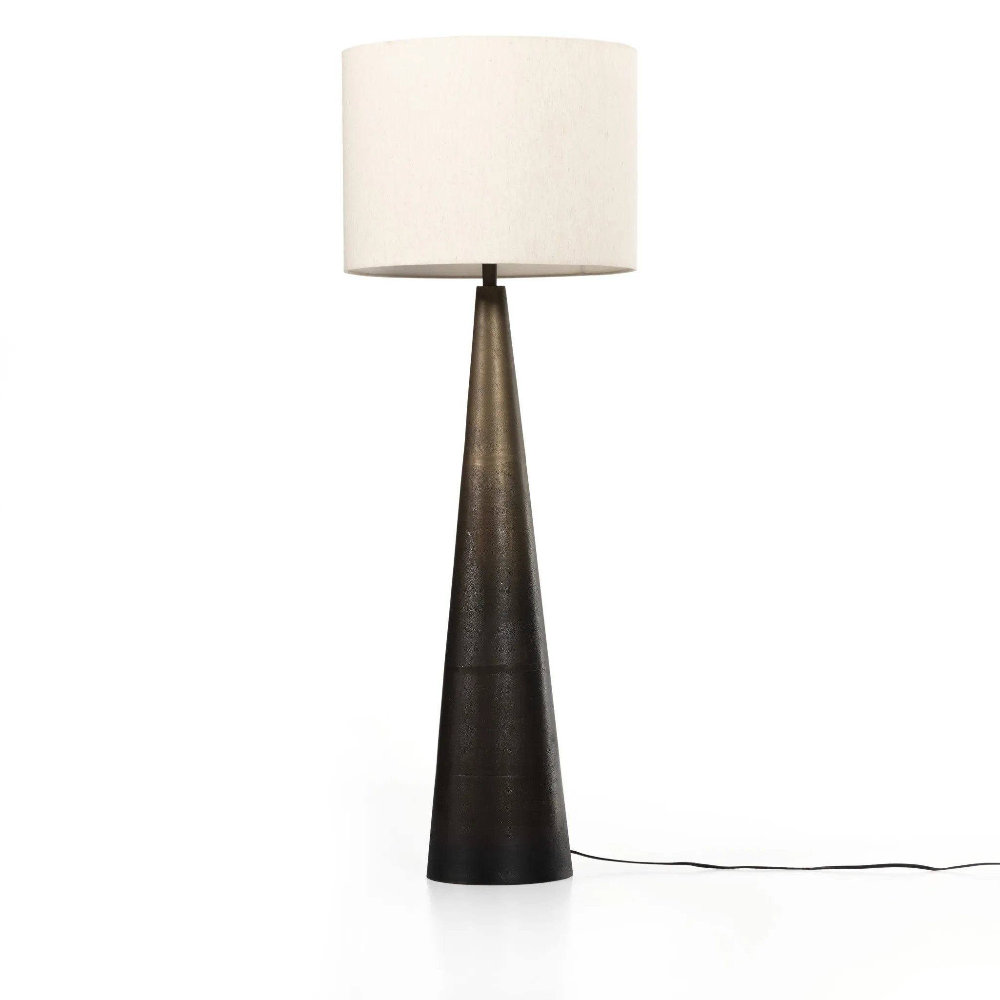 A striking silhouette. An antique brass finish highlights iron's gradual blending of hues for a distinctive ombre effect on this tapered metal base. Topped with a 100% cotton shade Amethyst Home provides interior design, new home construction design consulting, vintage area rugs, and lighting in the Seattle metro area.