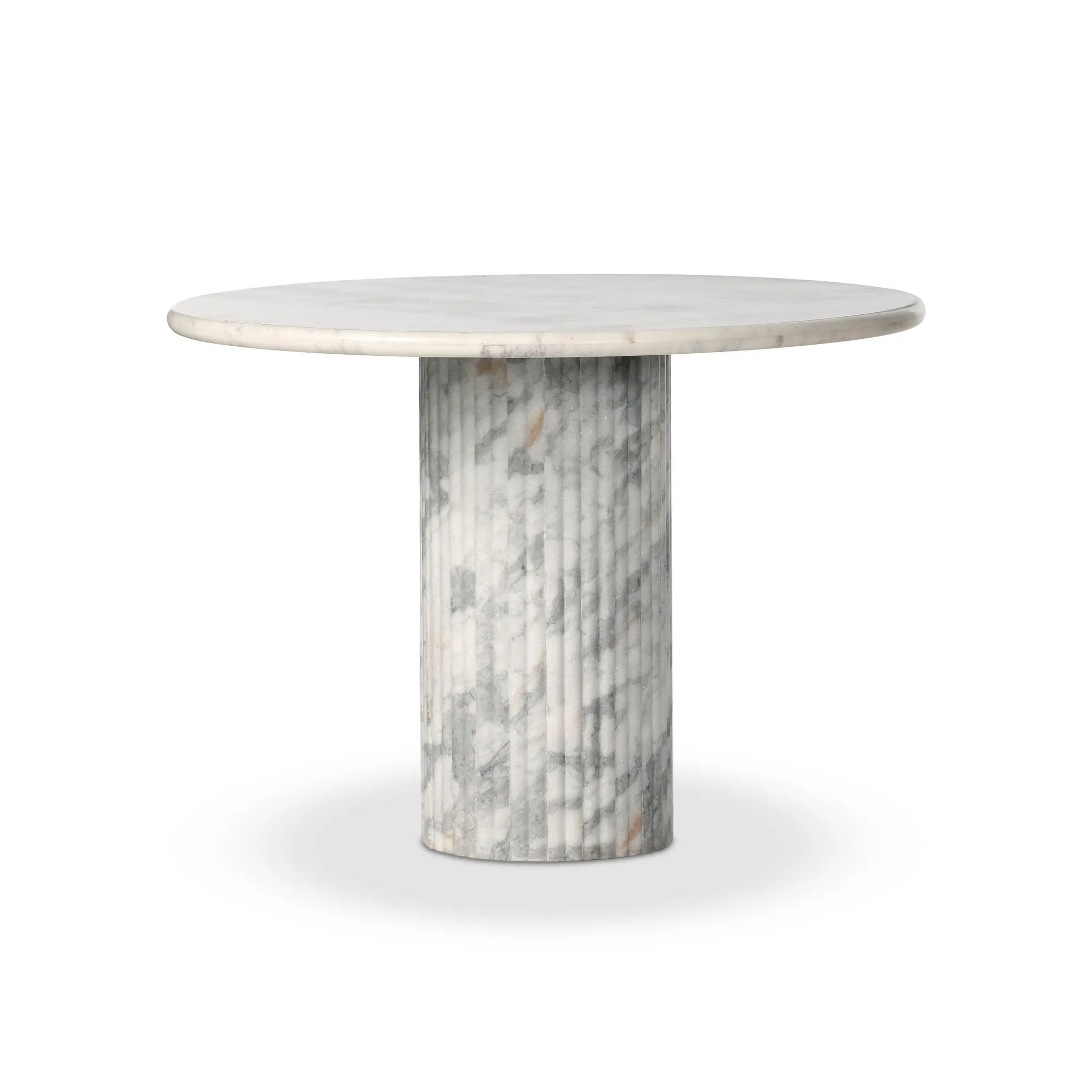 Featuring Oranda Polished White Marble Sealant Round Dining Table by Four Hands at Amethyst Home. Inspired by Italian design, a swirling marble base is scalloped for a linear look with heavy texture, finished with a rounded, bistro-size tabletop of polished white marble.Overall Dimensions: 42.00"w x 42.00"d x 30.00"hWeight : 195.00 lbsMaterials : Solid. Amethyst Home provides interior design, new home construction design consulting, vintage area rugs, and lighting in the Salt Lake City metro area.