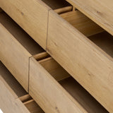 Light, worn oak forms a pedestal base, bringing gentle curves to a classic dresser shape. Six drawers bring spacious storage to the bedroom Amethyst Home provides interior design, new home construction design consulting, vintage area rugs, and lighting in the Des Moines metro area.