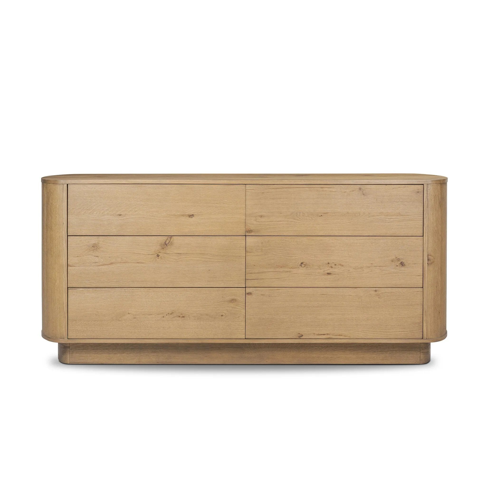 Light, worn oak forms a pedestal base, bringing gentle curves to a classic dresser shape. Six drawers bring spacious storage to the bedroom Amethyst Home provides interior design, new home construction design consulting, vintage area rugs, and lighting in the Monterey metro area.