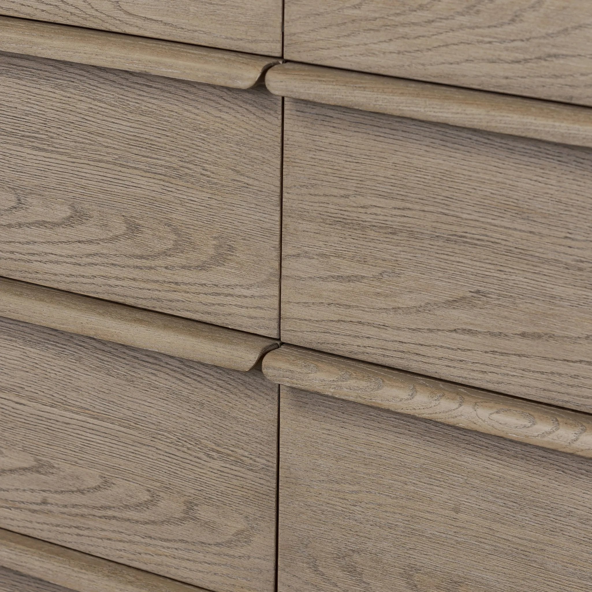 Rounded corners soften the straight-edged look of this 10-drawer dresser, crafted from natural oak in a warm grey finish. Wide smooth-gliding drawers are fully finished on the inside Amethyst Home provides interior design, new home construction design consulting, vintage area rugs, and lighting in the Newport Beach metro area.