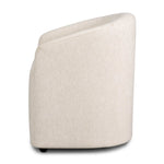 A fully upholstered barrel-style back dining chair creates a comfortable, cocoon-like sit. Slight scale perfect for smaller dining spaces Amethyst Home provides interior design, new home construction design consulting, vintage area rugs, and lighting in the Austin metro area.