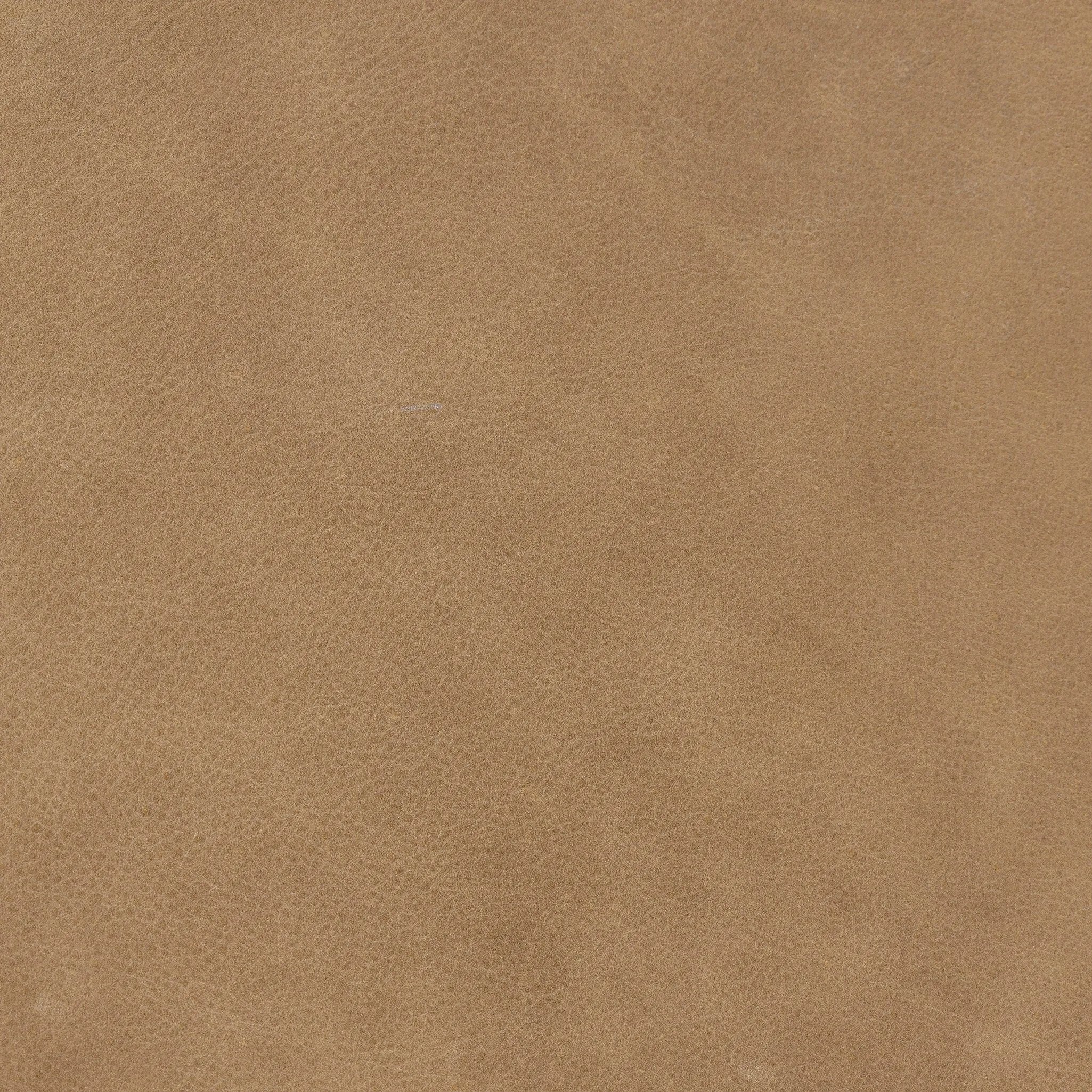 Rounded, chunky dowel legs in an amber oak finish frame the tan top-grain leather headboard of this simple-but-striking bed frame Amethyst Home provides interior design, new home construction design consulting, vintage area rugs, and lighting in the Nashville metro area.