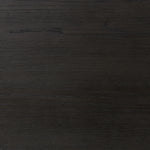 Create storage space in the bedroom with a five-drawer dresser of ebony-finished oak. Chunky dowel legs support a tall silhouette and overhang top, all finished out with simple gunmetal hardware Amethyst Home provides interior design, new home construction design consulting, vintage area rugs, and lighting in the Alpharetta metro area.