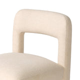 Fit for modern dining, this clean-styled chair is fully upholstered in a specialized performance fabric. An open back connects down to the cylindrical legs. Slight scale and squared off shape are great for smaller dining areas. Amethyst Home provides interior design, new home construction design consulting, vintage area rugs, and lighting in the Dallas metro area.