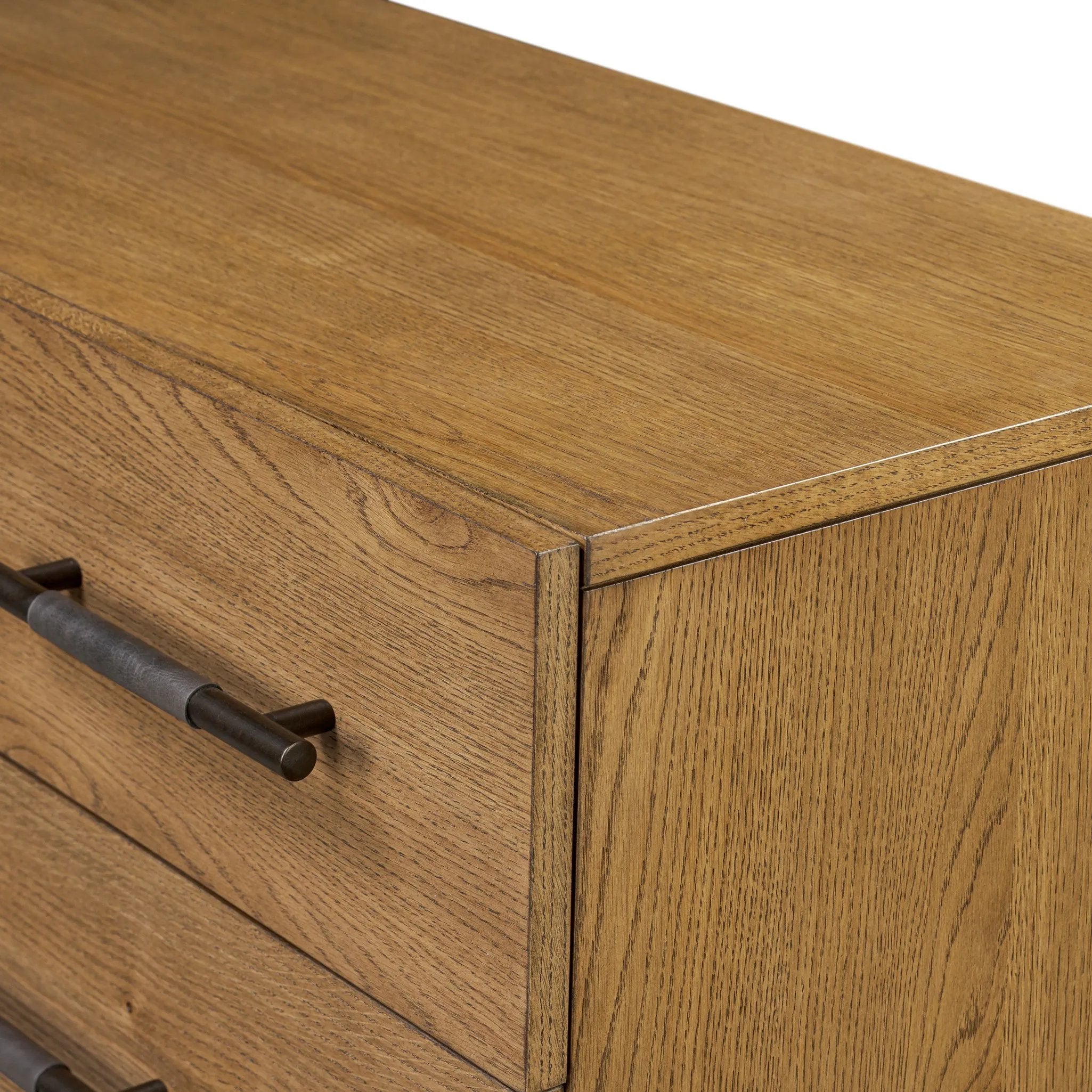 Amber-finished oak forms a clean silhouette for six spacious drawers with iron hardware wrapped in black top-grain leather. This item has been modified to comply with the STURDY Act. See a full list of modified products and data changes in the “STURDY Act” file in the Downloads section below Amethyst Home provides interior design, new home construction design consulting, vintage area rugs, and lighting in the Kansas City metro area.