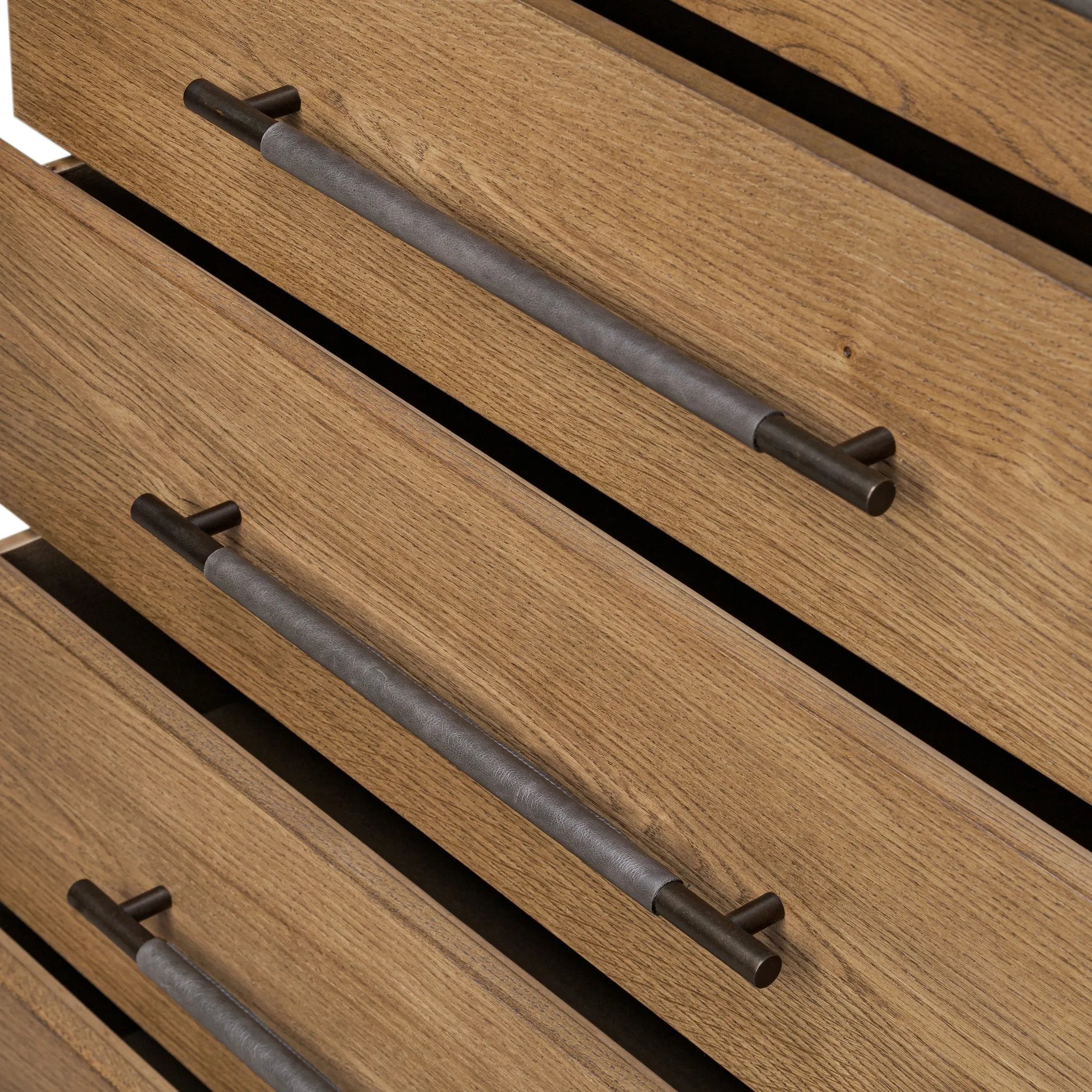 Amber-finished oak forms a clean silhouette for six spacious drawers with iron hardware wrapped in black top-grain leather. This item has been modified to comply with the STURDY Act. See a full list of modified products and data changes in the “STURDY Act” file in the Downloads section below Amethyst Home provides interior design, new home construction design consulting, vintage area rugs, and lighting in the Salt Lake City metro area.