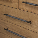 Amber-finished oak forms a clean silhouette for six spacious drawers with iron hardware wrapped in black top-grain leather. This item has been modified to comply with the STURDY Act. See a full list of modified products and data changes in the “STURDY Act” file in the Downloads section below Amethyst Home provides interior design, new home construction design consulting, vintage area rugs, and lighting in the Scottsdale metro area.