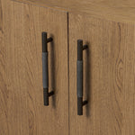 Amber-finished oak forms a clean silhouette with plenty of storage, accented with long iron hardware wrapped in black top-grain leather. Outset legs add an element of interest. Rear cutouts for cord management Amethyst Home provides interior design, new home construction design consulting, vintage area rugs, and lighting in the Scottsdale metro area.