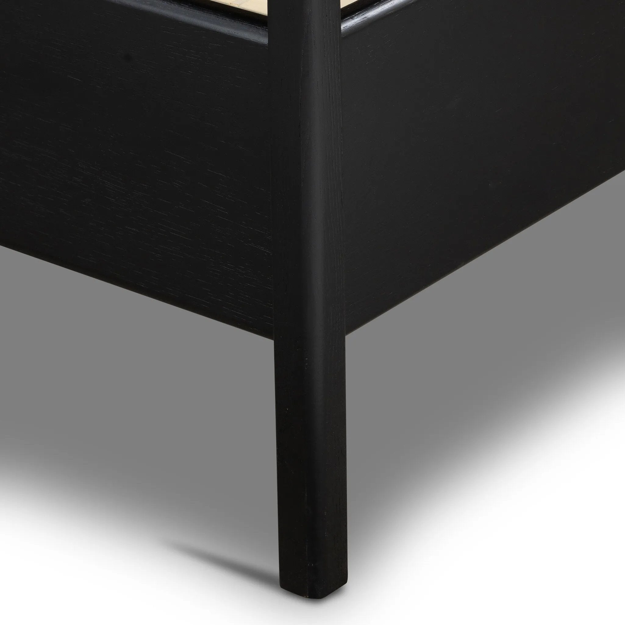 Ebony-finished oak frames a sling-style headboard made from top-grain leather, with subtly rounded edges and metal dowel detailing Amethyst Home provides interior design, new home construction design consulting, vintage area rugs, and lighting in the Dallas metro area.