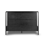 Ebony-finished oak frames a sling-style headboard made from top-grain leather, with subtly rounded edges and metal dowel detailing Amethyst Home provides interior design, new home construction design consulting, vintage area rugs, and lighting in the Seattle metro area.