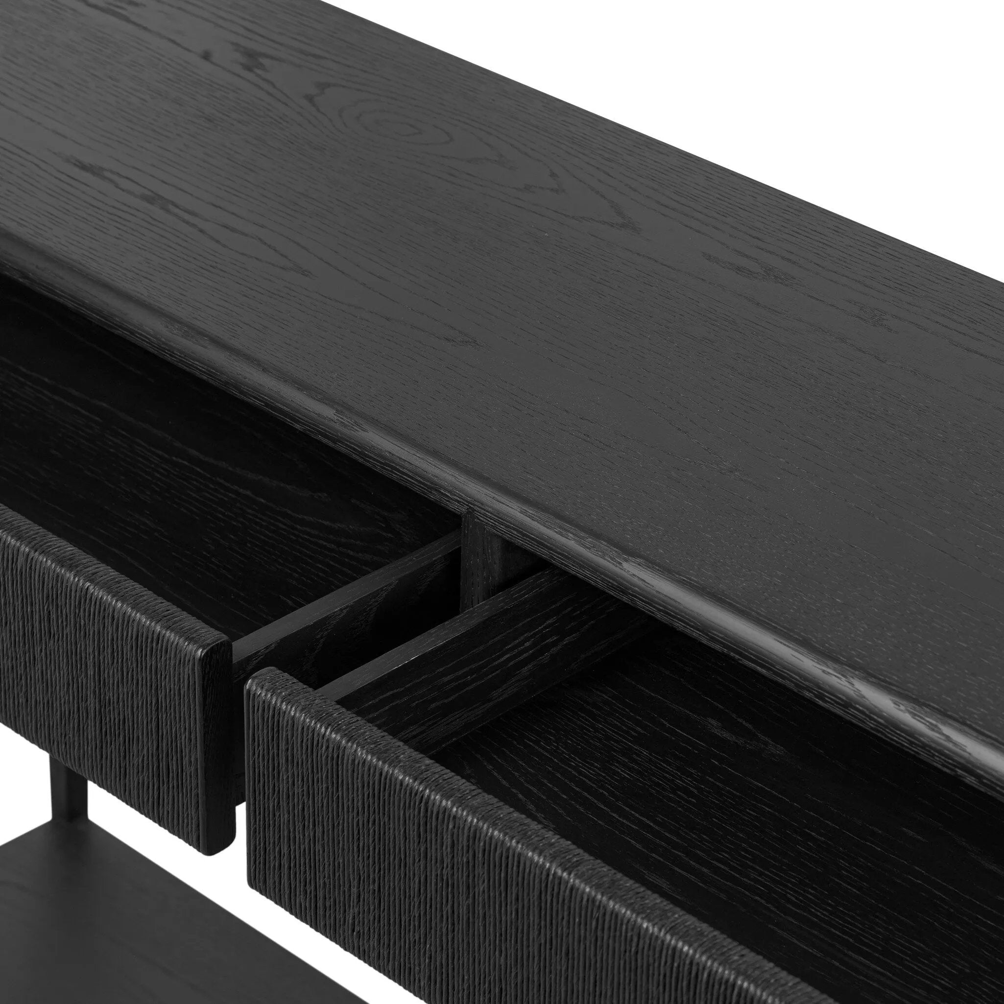 Featuring Rosenell Black Oak Veneer Console Table 60" by Four Hands at Amethyst Home. Elevate your living space or media room with a slim-profile console of black-finished oak. A smooth top pairs with two drawers covered with woven paper cord, while lower open shelving creates bonus storage and display options. The result: a dark, Scandinavian-inspired lo. Amethyst Home provides interior design, new home construction design consulting, vintage area rugs, and lighting in the Los Angeles metro area.