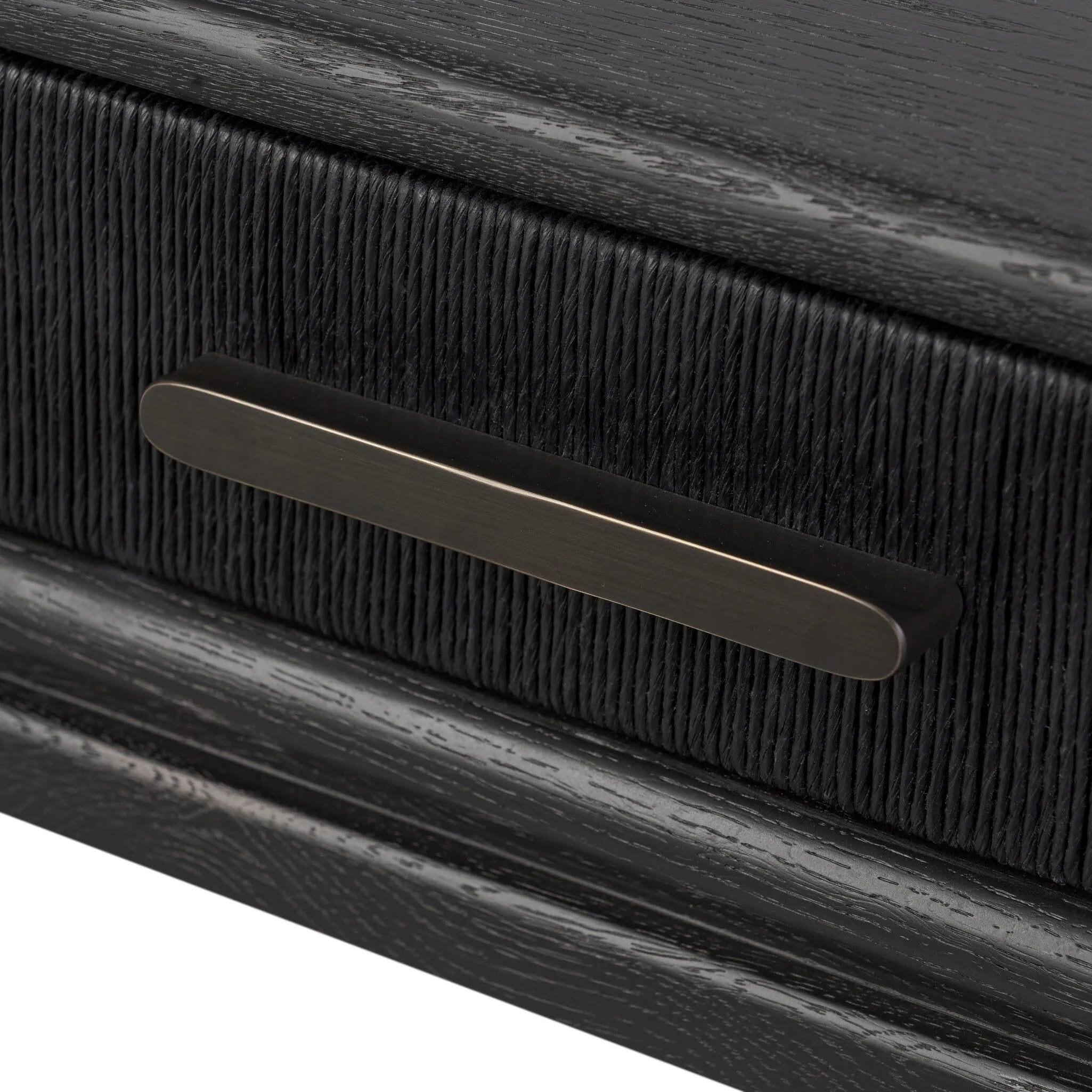 Featuring Rosenell Black Oak Veneer Console Table 78" by Four Hands at Amethyst Home. Elevate your living space or media room with a slim-profile console of black-finished oak. A smooth top pairs with three drawers covered with woven paper cord, while lower open shelving creates bonus storage and display options. The result: a dark, Scandinavian-inspired look . Amethyst Home provides interior design, new home construction design consulting, vintage area rugs, and lighting in the Austin metro area.