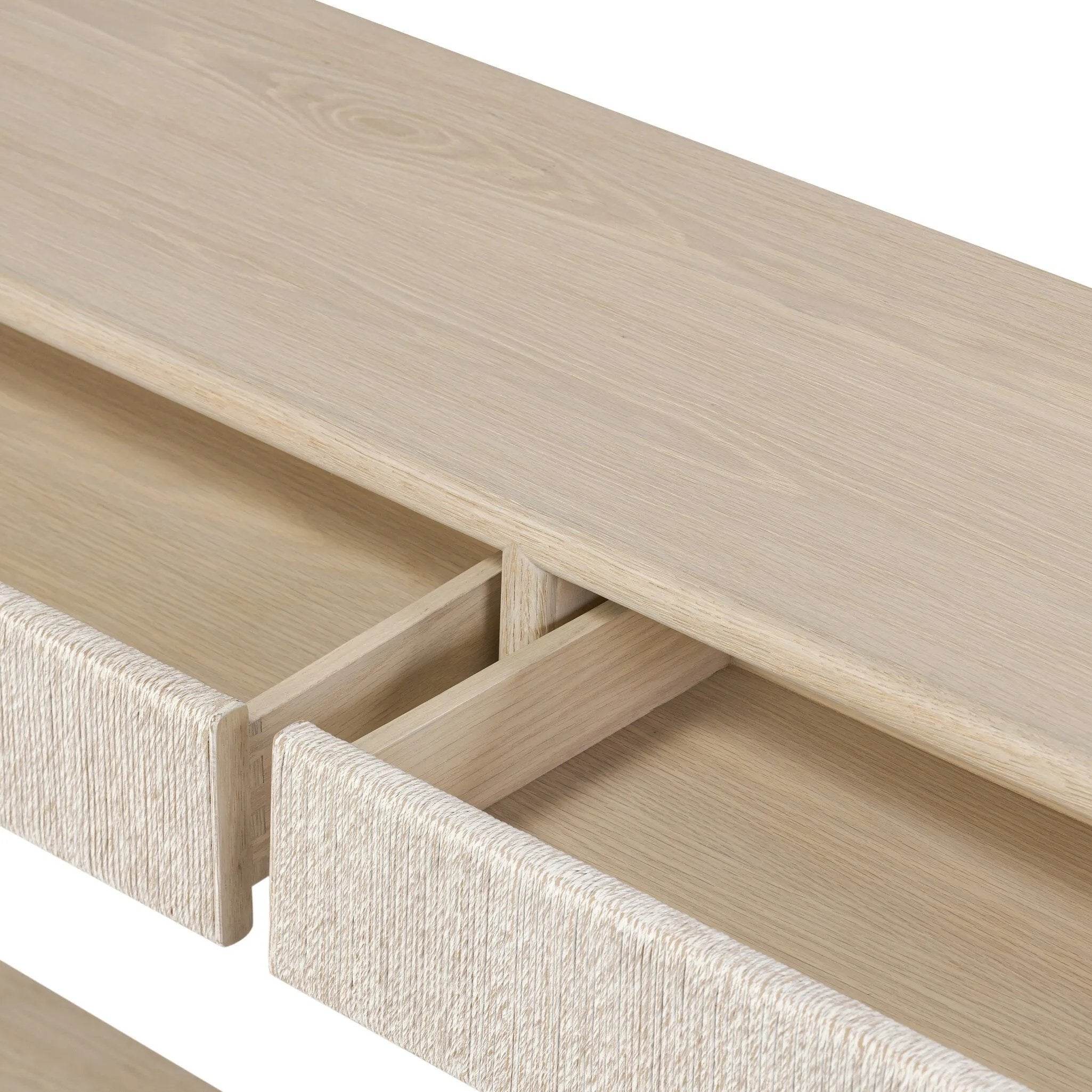 Featuring Rosenell Natural Oak Veneer Console Table 60" by Four Hands at Amethyst Home. Elevate your living space or media room with a slim-profile console of light, natural oak. A smooth top pairs with two drawers covered with woven paper cord, while lower open shelving creates bonus storage and display options. The result: a clean, Scandinavian-inspired . Amethyst Home provides interior design, new home construction design consulting, vintage area rugs, and lighting in the Washington metro area.