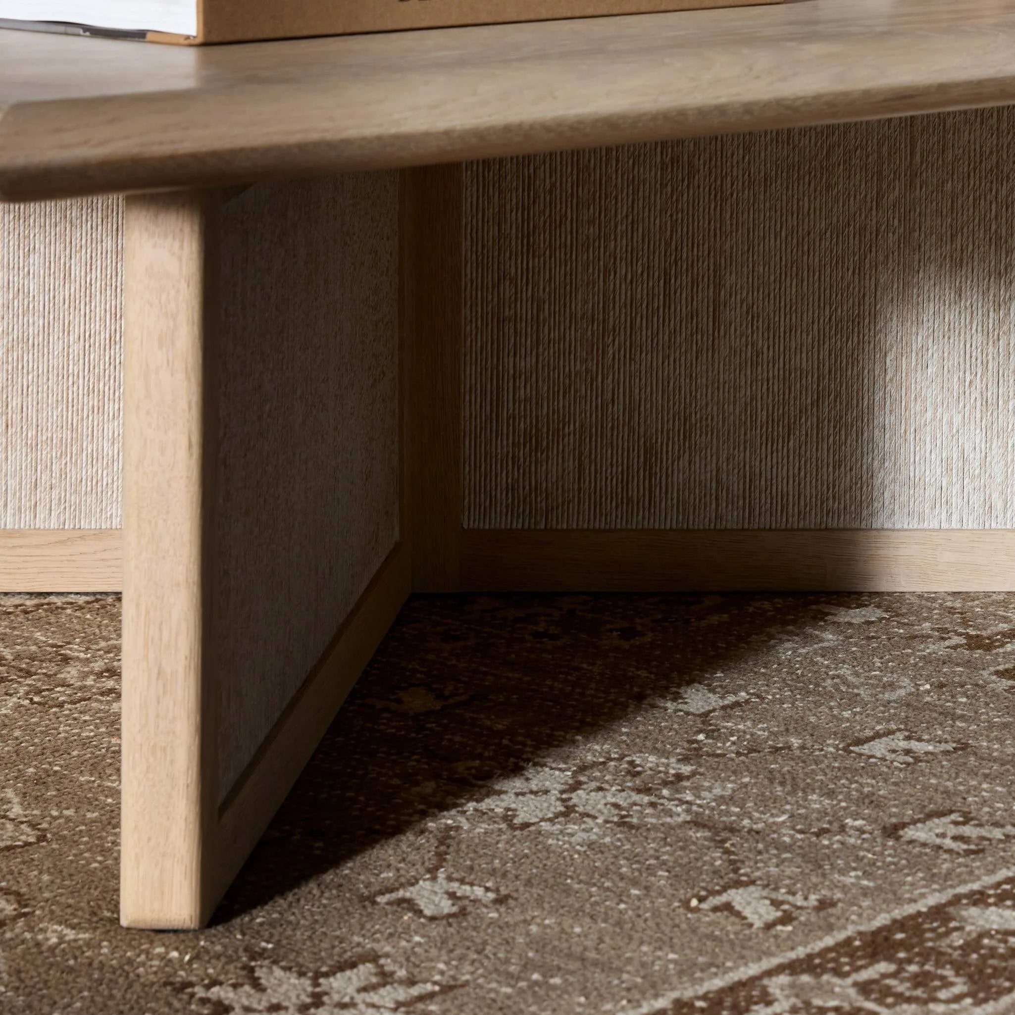 Featuring Rosenell Natural Oak Veneer Square Coffee Table by Four Hands at Amethyst Home. Anchor your living space with a squared coffee table of light, natural oak. A smooth top pairs with a panel-style base of woven paper cord for a clean, Scandinavian-inspired look that will work into your collection beautifully. Overall Dimensions: 55.00"w x 55.00"d x 1. Amethyst Home provides interior design, new home construction design consulting, vintage area rugs, and lighting in the Nashville metro area.