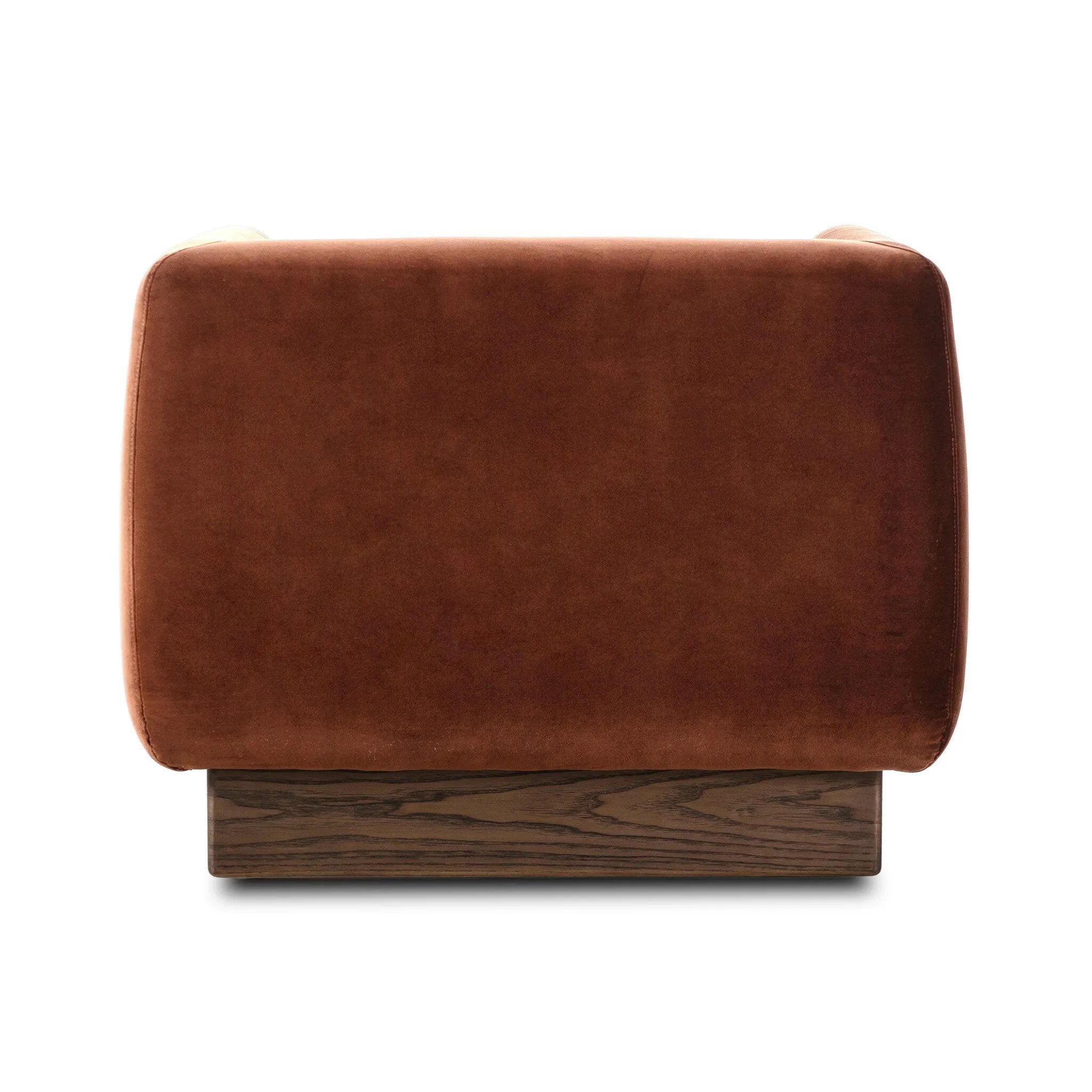 Velvety upholstery in a deep auburn hue covers clean-angled, deeply cushioned seating with a 360-degree swivel base for relaxed lounging and conversation Amethyst Home provides interior design, new home construction design consulting, vintage area rugs, and lighting in the Los Angeles metro area.