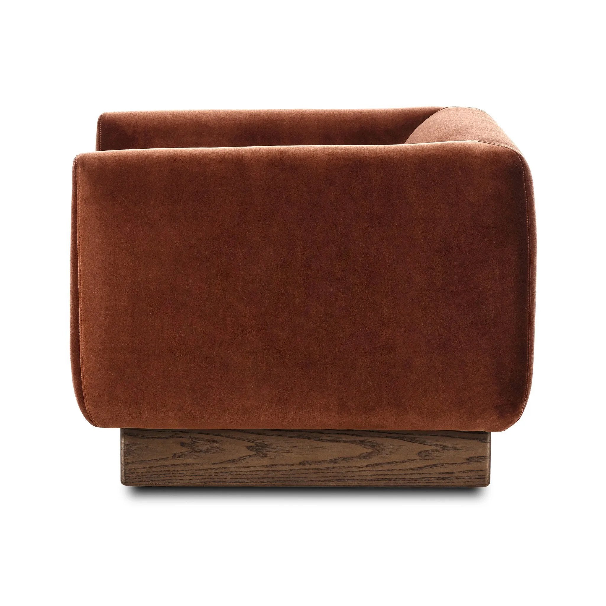 Velvety upholstery in a deep auburn hue covers clean-angled, deeply cushioned seating with a 360-degree swivel base for relaxed lounging and conversation Amethyst Home provides interior design, new home construction design consulting, vintage area rugs, and lighting in the Seattle metro area.