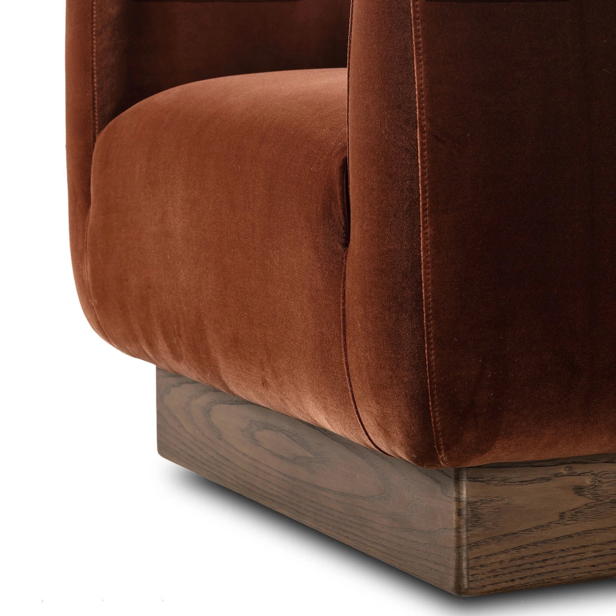 Velvety upholstery in a deep auburn hue covers clean-angled, deeply cushioned seating with a 360-degree swivel base for relaxed lounging and conversation Amethyst Home provides interior design, new home construction design consulting, vintage area rugs, and lighting in the Winter Garden metro area.