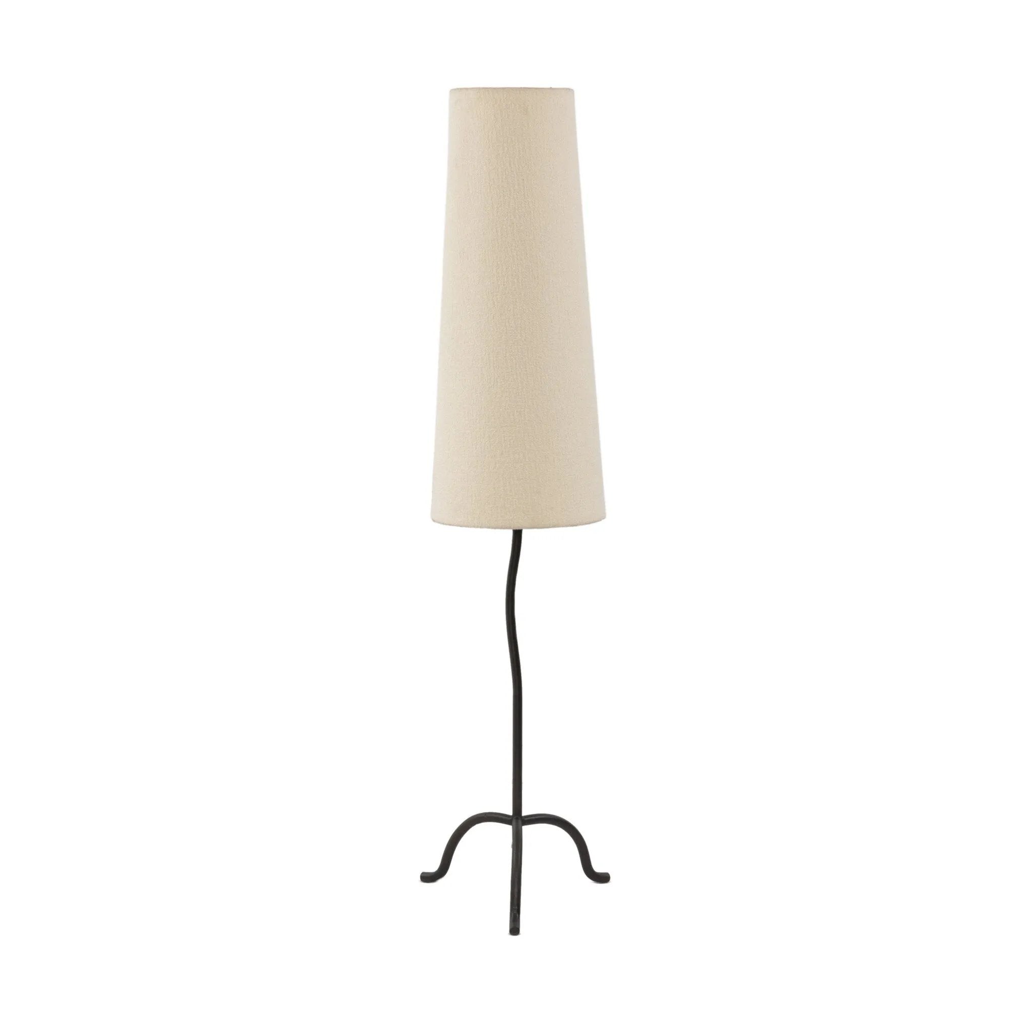 Featuring Selby Black Wrought Iron Floor Lamp by Four Hands at Amethyst Home. A curved cast iron tripod base pairs with an elongated boucle shade for a sculpted, minimalist look that works into any room with ease. Overall Dimensions: 12.75"w x 12.75"d x 60.00"h. Amethyst Home provides interior design, new home construction design consulting, vintage area rugs, and lighting in the Laguna Beach metro area.