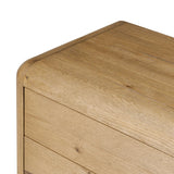 Blending modern design with classic features, this dresser is at once soft and bold. Set low to the ground on rounded feet, the dresser has prominent rounded corners that emphasize its smooth finish. Crafted from solid warm oak and veneers with push-latch hardware for a clean front Amethyst Home provides interior design, new home construction design consulting, vintage area rugs, and lighting in the Calabasas metro area.