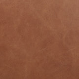 Shiny stainless steel frames tan top-grain leather cushioning for a balance of comfort and edge. Overfilled for a relaxed sit, the cushioned seat and back keep things supportive. Adjustable height and smooth 360-swivel bring ease to your workspace Amethyst Home provides interior design, new home construction design consulting, vintage area rugs, and lighting in the Newport Beach metro area.