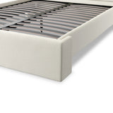 A shorter wingspan and geometric cutouts define this modern-day shelter wingback bed, designed for comfort from every angle. Upholstered in a cream fabric with subtle texture and a soft hand Amethyst Home provides interior design, new home construction design consulting, vintage area rugs, and lighting in the Newport Beach metro area.