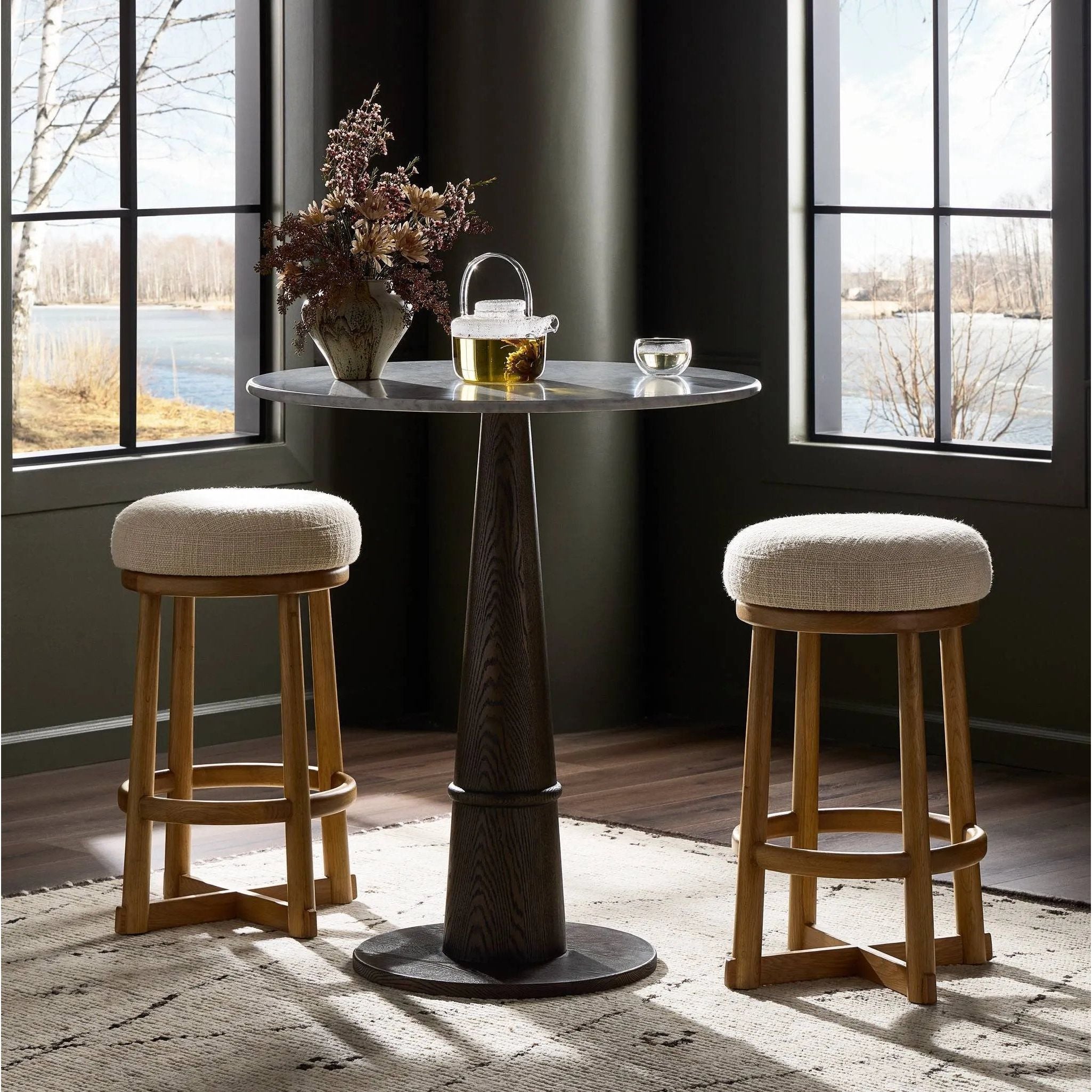 Featuring Staria Saxon Sand Swivel Stool by Four Hands at Amethyst Home. Perfectly sized for the counter, a 360-degree swivel stool pairs a warm oak frame with sand seating in a chunky basketweave. Tapered legs meet a crossed base ties it all together. Overall Dimensions: 18.25"w x 18.25"d x 27.50"h. Amethyst Home provides interior design, new home construction design consulting, vintage area rugs, and lighting in the Boston metro area.