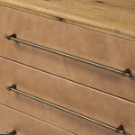 Bring a Nordic, material-driven look to your bedroom with a six-drawer dresser of grain-rich oak and drawer fronts covered with tan top-grain leather. Finished out with long, linear iron hardware Amethyst Home provides interior design, new home construction design consulting, vintage area rugs, and lighting in the Washington metro area.