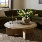 Featuring Surie Sandy Oak Resawn Coffee Table by Four Hands at Amethyst Home. A shape-driven piece inspired by clean Nordic design. Softened edges and a curved base craft a sense of flow, accentuated by cathedral grain oak with beautiful natural warmth. Overall Dimensions: 48.00"w x 48.00"d x 16.50"h. Amethyst Home provides interior design, new home construction design consulting, vintage area rugs, and lighting in the Los Angeles metro area.