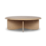 Featuring Surie Sandy Oak Resawn Coffee Table by Four Hands at Amethyst Home. A shape-driven piece inspired by clean Nordic design. Softened edges and a curved base craft a sense of flow, accentuated by cathedral grain oak with beautiful natural warmth. Overall Dimensions: 48.00"w x 48.00"d x 16.50"h. Amethyst Home provides interior design, new home construction design consulting, vintage area rugs, and lighting in the Winter Garden metro area.