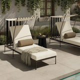 Statement-making comfort. This outdoor chaise brings a modern, French Deco-inspired look with bold color contrast to the patio. High back vertical slats pair with the removable canopy and small finial details for a unique take on traditional. Cover or store indoors during inclement weather and when not in use Amethyst Home provides interior design, new home construction design consulting, vintage area rugs, and lighting in the Boston metro area.
