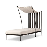 Statement-making comfort. This outdoor chaise brings a modern, French Deco-inspired look with bold color contrast to the patio. High back vertical slats pair with the removable canopy and small finial details for a unique take on traditional. Cover or store indoors during inclement weather and when not in use Amethyst Home provides interior design, new home construction design consulting, vintage area rugs, and lighting in the Nashville metro area.