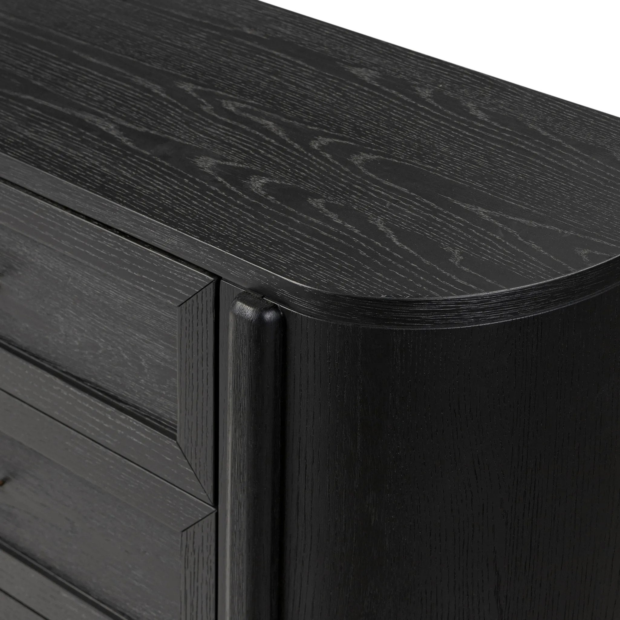 Infuse your collection with timeless midcentury design. Crafted from oak and parawood, a six-drawer dresser is finished in a matte black, with simple brass hardware Amethyst Home provides interior design, new home construction design consulting, vintage area rugs, and lighting in the Newport Beach metro area.