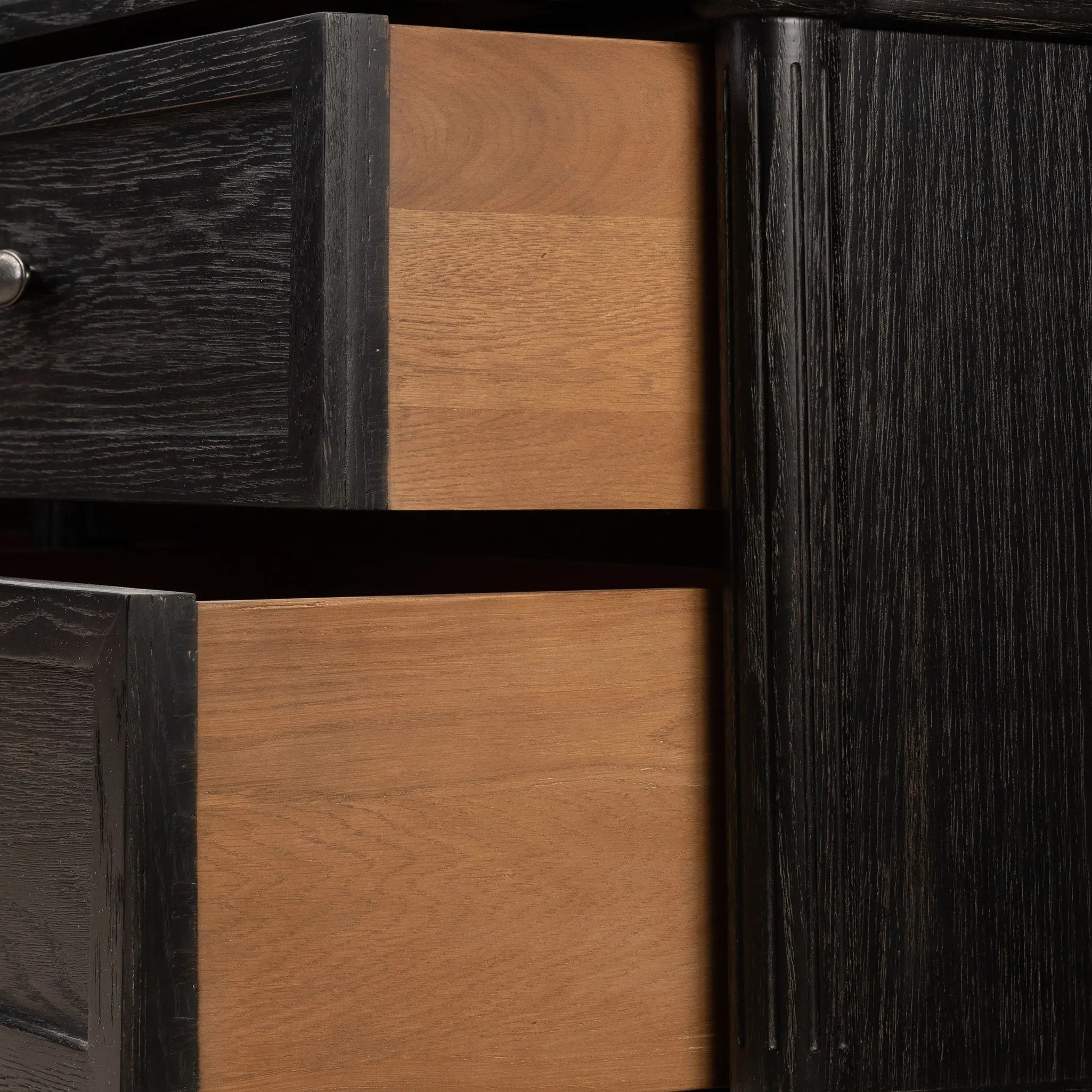Made from distressed black-finished oak with slim legs, nine drawers bring antique European vibes to modern bedroom styling. This item has been modified to comply with the STURDY Act. See a full list of modified products and data changes in the “STURDY Act” file in the Downloads section below Amethyst Home provides interior design, new home construction design consulting, vintage area rugs, and lighting in the Seattle metro area.