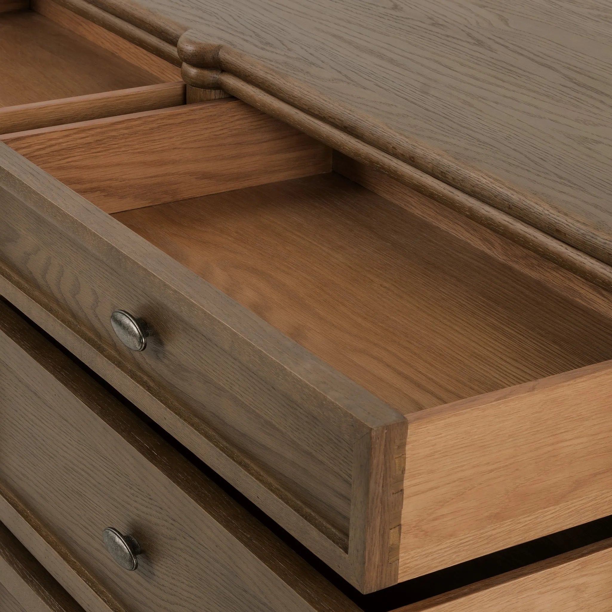 Made from toasted oak with slim legs, nine drawers bring antique European vibes to modern bedroom styling. This item has been modified to comply with the STURDY Act. See a full list of modified products and data changes in the “STURDY Act” file in the Downloads section below Amethyst Home provides interior design, new home construction design consulting, vintage area rugs, and lighting in the Alpharetta metro area.