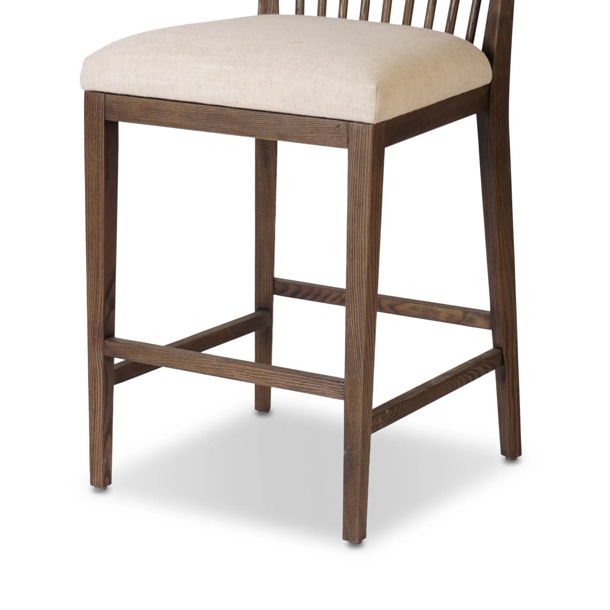 A low, linear counter stool inspired by Japanese tea houses, crafted from natural ash. Designed for comfort, a thick cushion seat is upholstered in a casual poly-linen blend Amethyst Home provides interior design, new home construction design consulting, vintage area rugs, and lighting in the Washington metro area.