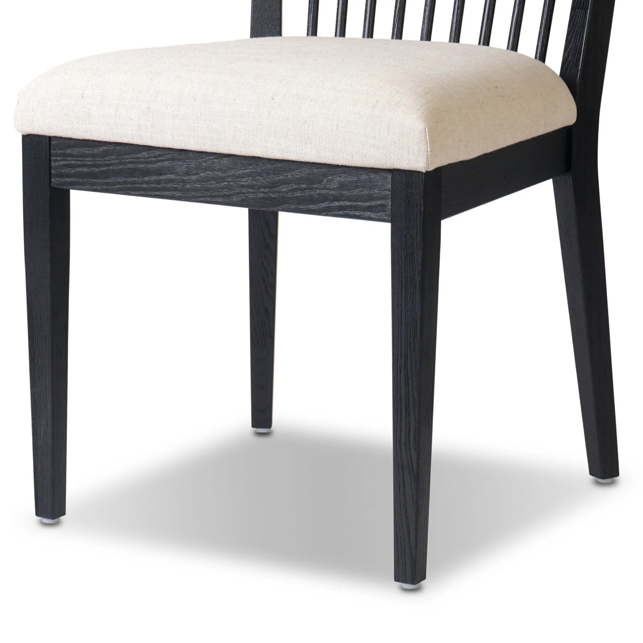 A linear dining style inspired by Japanese tea houses, crafted from black-finished ash. Designed for comfort, a thick cushion seat is upholstered in a casual poly-linen blend Amethyst Home provides interior design, new home construction design consulting, vintage area rugs, and lighting in the Newport Beach metro area.