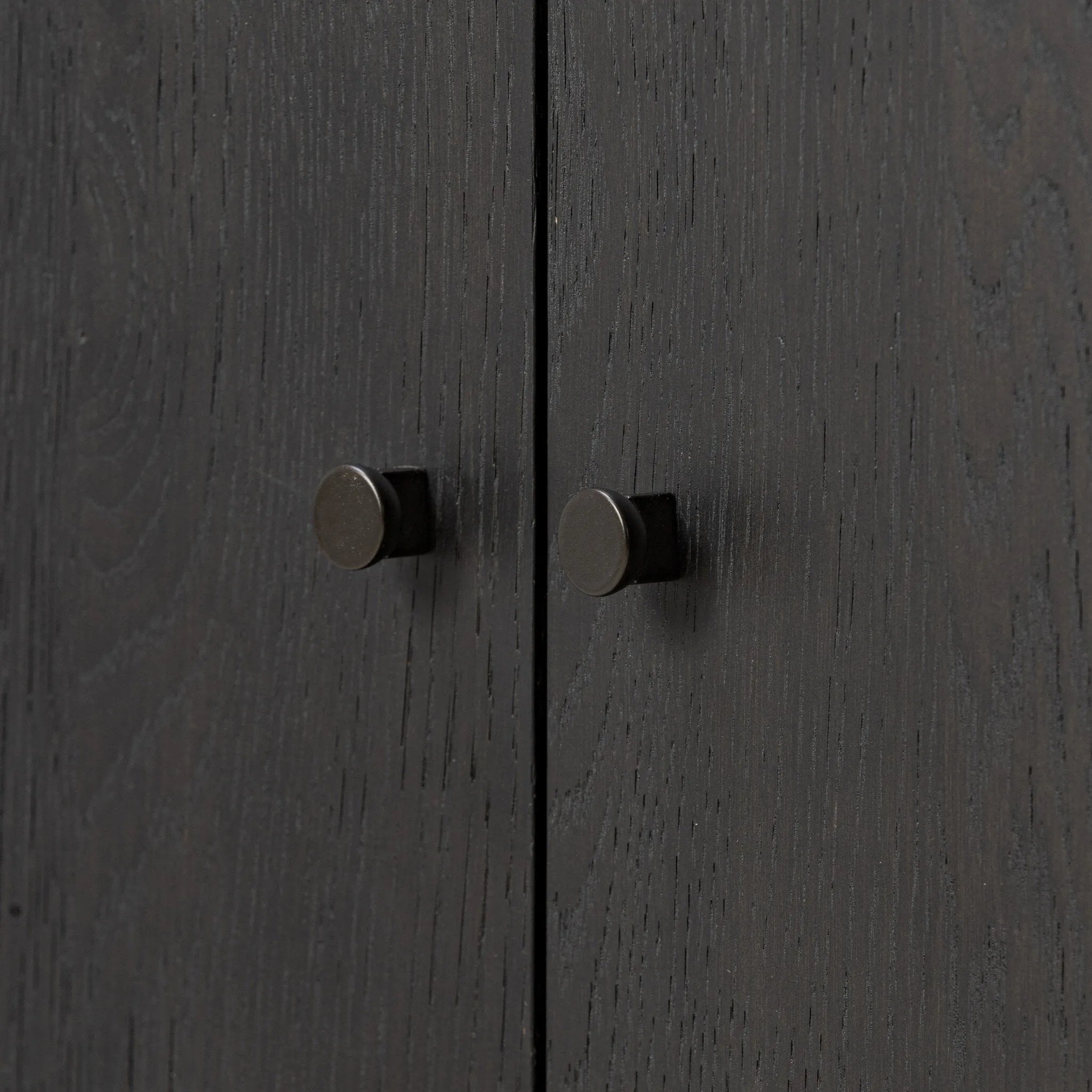 Lacquered cabinets make for evocative storage with their everlasting glossy finish. Great for small spaces, this sideboard with interior shelves features worn black oak doors for balance and contrast Amethyst Home provides interior design, new home construction design consulting, vintage area rugs, and lighting in the Miami metro area.