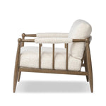 Featuring Warren Ivan Snow Chair by Four Hands at Amethyst Home. A classic silhouette through a contemporary lens. Framed in vintage oak, this accent chair features tapered legs, spindles along the arms and bauble details. Finished in Turkish-made upholstery with a heavy pile that blends brushed, pulled and boucle styles, it's woven into a subtle linear pattern. Amethyst Home provides interior design, new home construction design consulting, vintage area rugs, and lighting in the Tampa metro area.