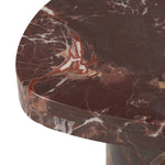 Shape and material share the spotlight in this pedestal-style end table of solid marble finished in a rich merlot with natural veining Amethyst Home provides interior design, new home construction design consulting, vintage area rugs, and lighting in the Des Moines metro area.