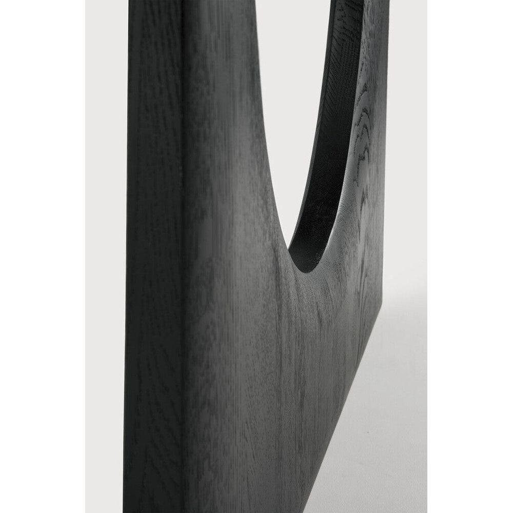 Featuring Geometric Oak Black Rectangular Dining Table by Ethnicraft at Amethyst Home. With enriched shapes and unexpected details, the Geometric solid oak dining table is a statement item, equally at home in the dining room or workspace. Luxury comes with its length, which is offset by softened edges and natural lines. Interesting shapes are in play to add volume and practical com. Amethyst Home provides interior design, new construction, custom furniture, and area rugs in the Monterey metro area